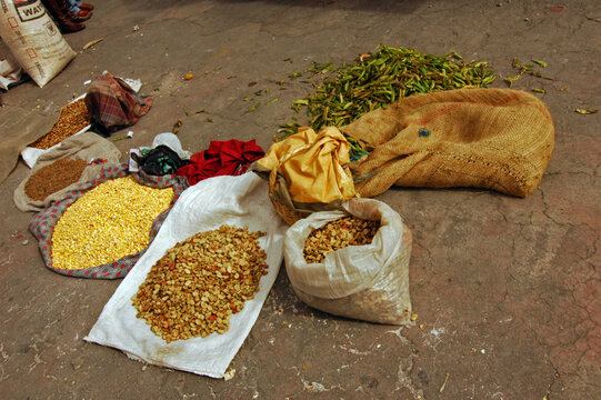 Sacks of corn kernels beans and pea pods on the ground at a market, Imbabura, Otavalo, Ecuador