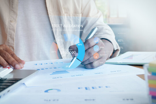 Businessman writing on document with digital asset allocation interface overlay showing pie chart, stocks, bonds, real estate, and cash, concept of investment portfolio diversification.