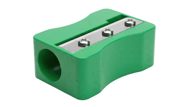 Green plastic pencil sharpener with metal blade isolated