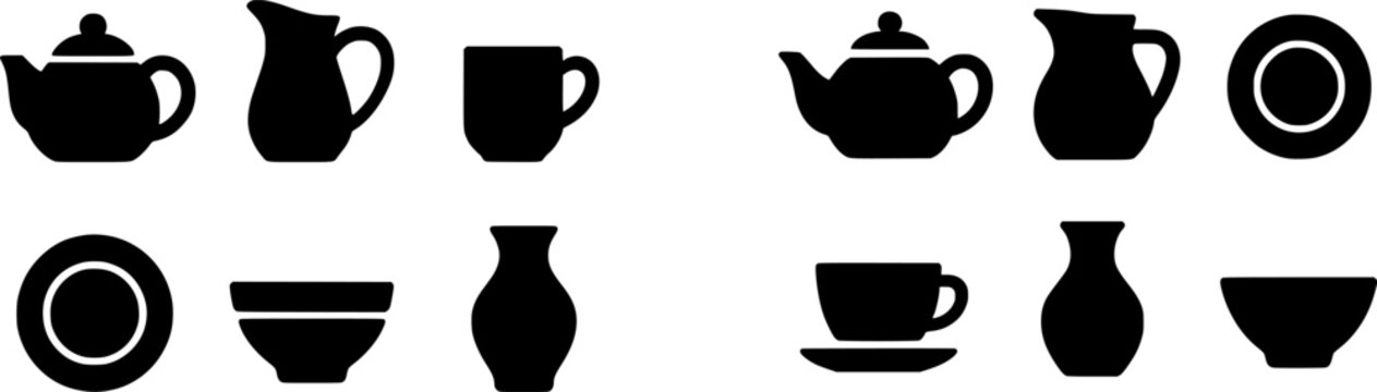 A classic teapot set with a traditional design, featuring elegant handles and spouts, sits atop a wooden surface in a cozy, rustic setting