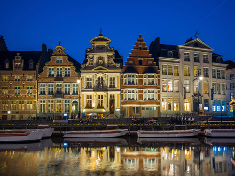 Belgium, Ghent, promenade at Korenlei with historical houses in the evening