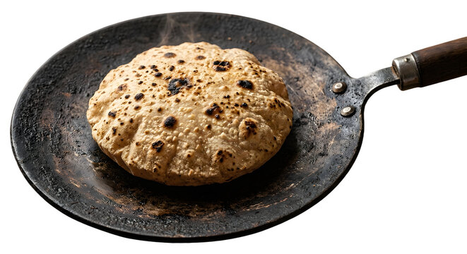 Fresh hot roti or chapati baking on iron tawa