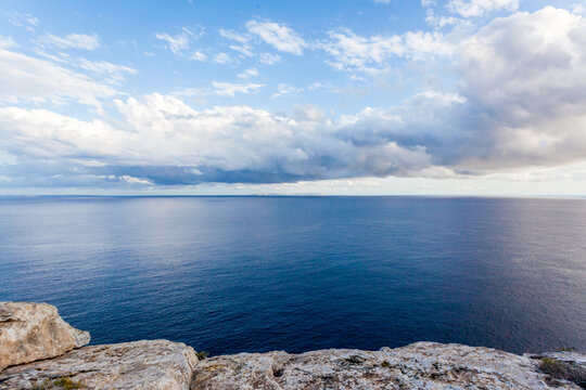 View of uninhabited cabrera island and cap blanc lighthouse