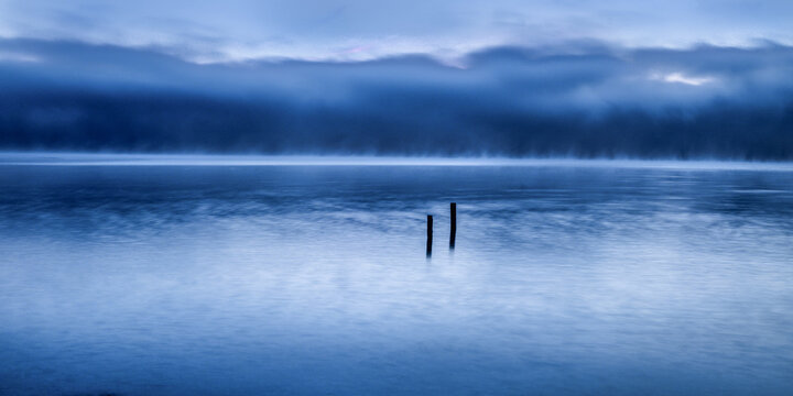 Roseninsel island at Lake Starnberg in morning blue hour mist
