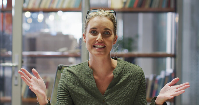 Image of caucasian businesswoman having image call in office