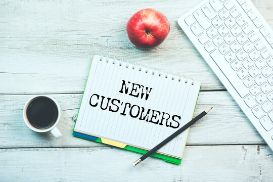 NEW CUSTOMERS text on paper