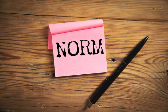 NORM word written on paper