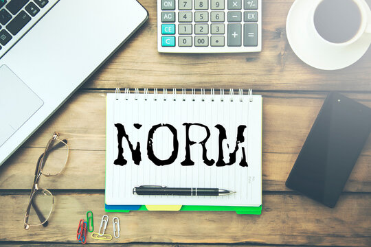 NORM word written on paper