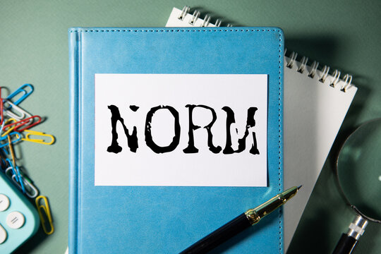NORM word written on paper