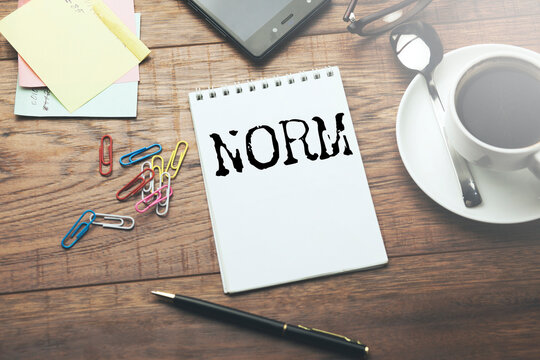 NORM word written on paper
