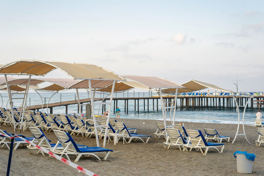 Beach with Sun Loungers and Pier in Alanya, Turkey