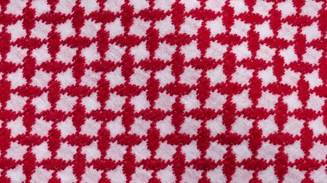 Macro close up 3D animation of a traditional red and white Arab keffiyeh shemagh fabric texture waving in the wind, Middle Eastern cultural textile background