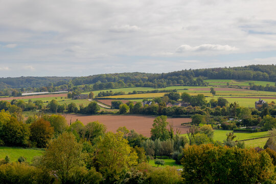 Autumn landscape, The terrain hilly countryside in border of Netherlands and Belgium, A small villages and houses on hillside with farmland and forest, Sint-Martens-Voeren, Belgian province of Limburg