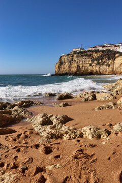 Rocky sandy beach on a sunny winter day in southern Portugal.