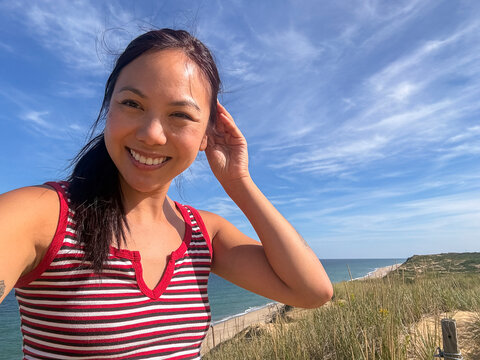 Asian Girl selfie  beach looking at camera