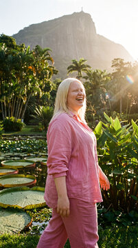 Woman walks through botanical garden