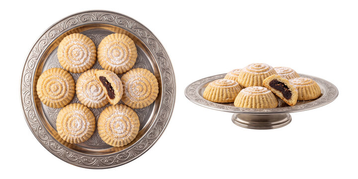 traditional arabic maamoul cookies with date filling served on a silver platter