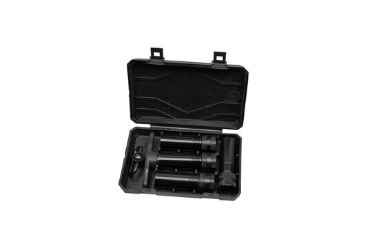 Black plastic storage case with shotgun choke tubes isolated on a white back