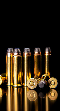 Golden rifle ammunition on black background