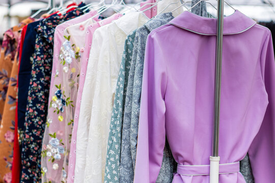 Assorted apparel on hangers for sale