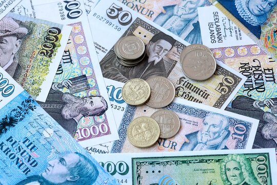 Icelandic krona money banknotes and coins on table. Iceland cash bills of ISK currency