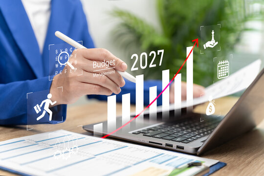 2027 Business Budget Management and Financial Planning Concept, Businesswoman Allocating Investment and Marketing Budgets to Reduce Losses, Improve Business Performance and Maximise Profitability