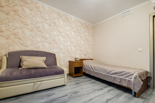 interior of cheapest bedroom in studio apartments or hostel.