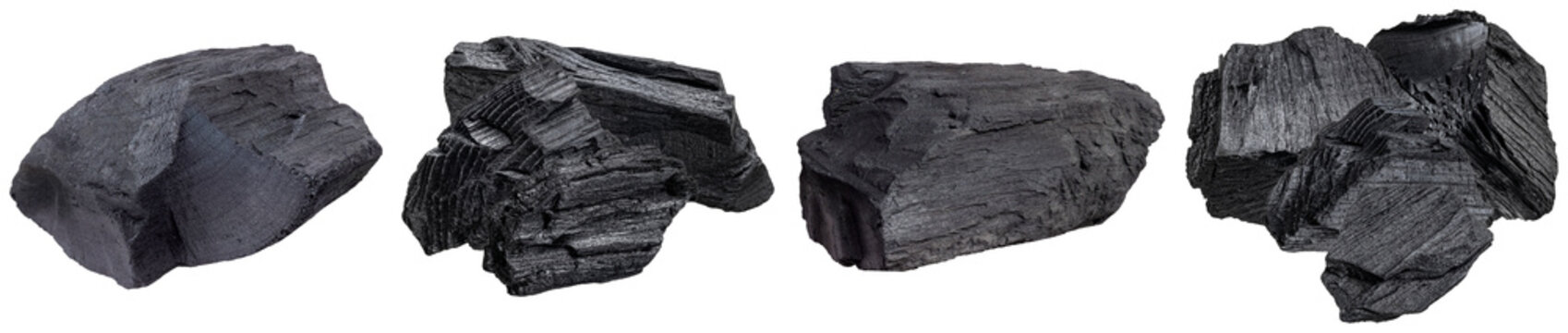 Rustic lumps of natural wood charcoal, featuring rough textures and deep dark tones, isolated on transparent background.