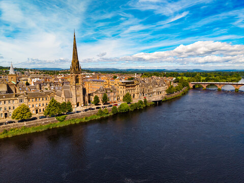 Aerial view of St. Matthew's Church, Perth rooftops, the River Tay, and Smeaton's Bridge under in Scotland, United Kingdom.