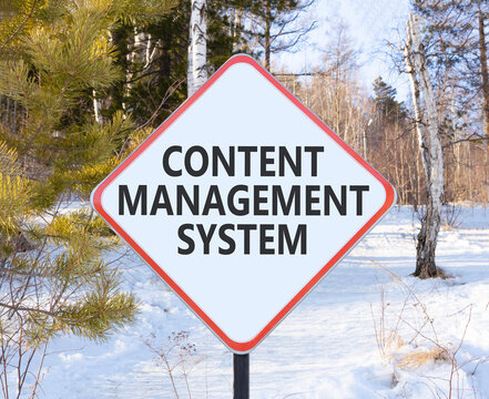 Content management system symbol. Concept words Content management system on beautiful white road sign. Beautiful winter forest background. Business content management system concept. Copy space.