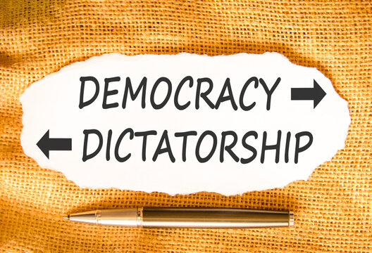 Democracy or dictatorship words symbol. Concept words Democracy Dictatorship on beautiful white paper. Beautiful canvas background. Business democracy dictatorship concept. Copy space