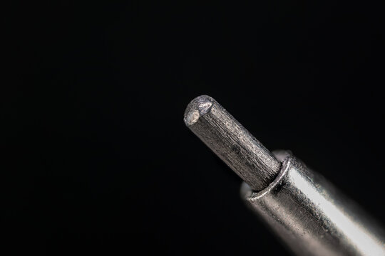 Macro close-up of a mechanical pencil lead tip.