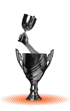 A hand lifts a small trophy above a larger cup, with both awards set against an orange dotted pattern on a transparent background.