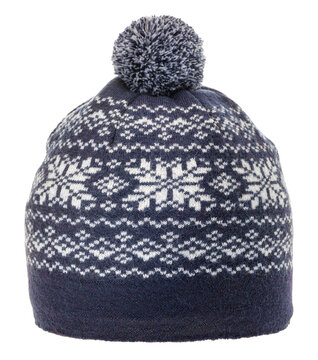 Winter hat stands centered on blank white surface. blue knit cap features classic jacquard fair isle ornament, soft woolly bobble, and comfortable knitted design crafted for cold weather wear