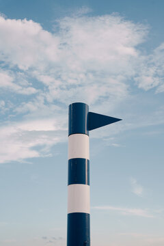 Blue and White Directional Marker