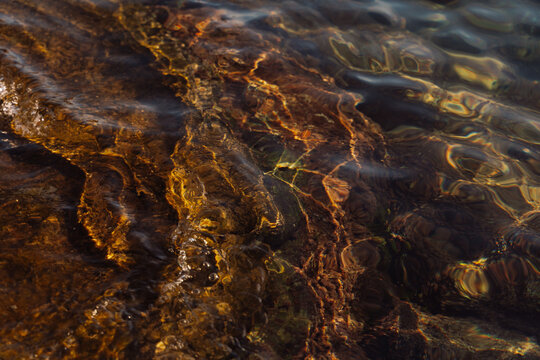 Light Reflection on Calm Water at the Shore