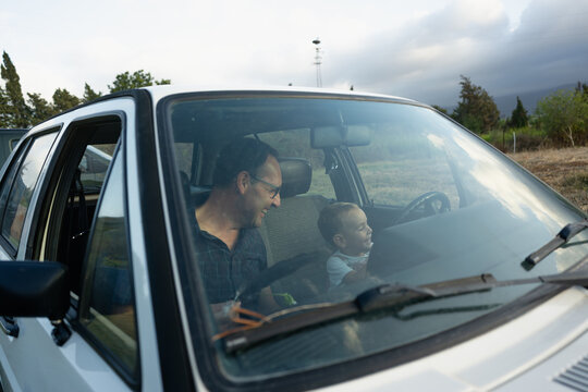 Father and son bonding in car
