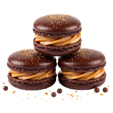 Chocolate macarons with caramel filling stacked together